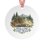 Back view of a round aluminum ornament with hiking artwork.