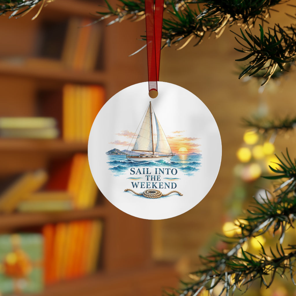 Lifestyle view of the round ornament with sailing artwork and red hanging ribbon.