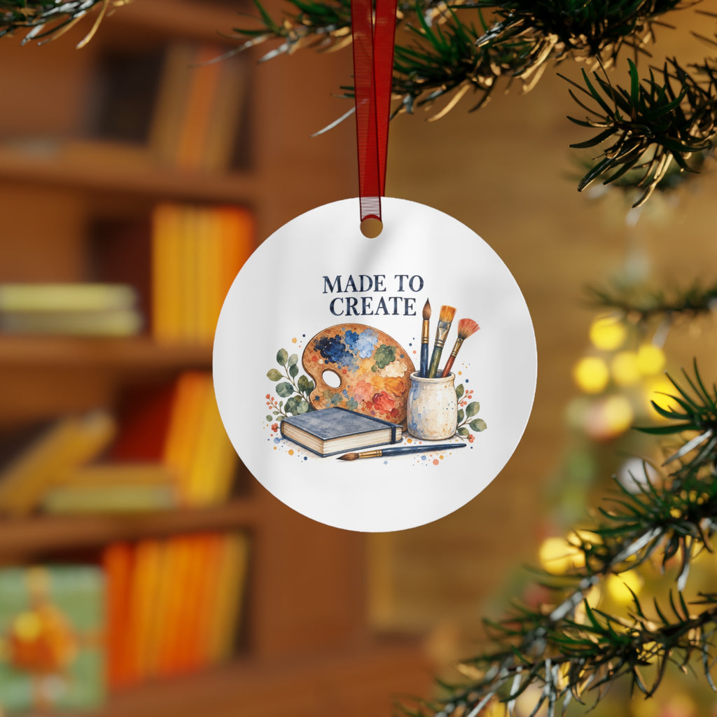 Lifestyle view of the round ornament with art teaching artwork and red hanging ribbon.