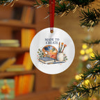 Lifestyle view of the round ornament with art teaching artwork and red hanging ribbon.