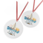 Front and back views of the double-sided round ornament with sailing artwork.
