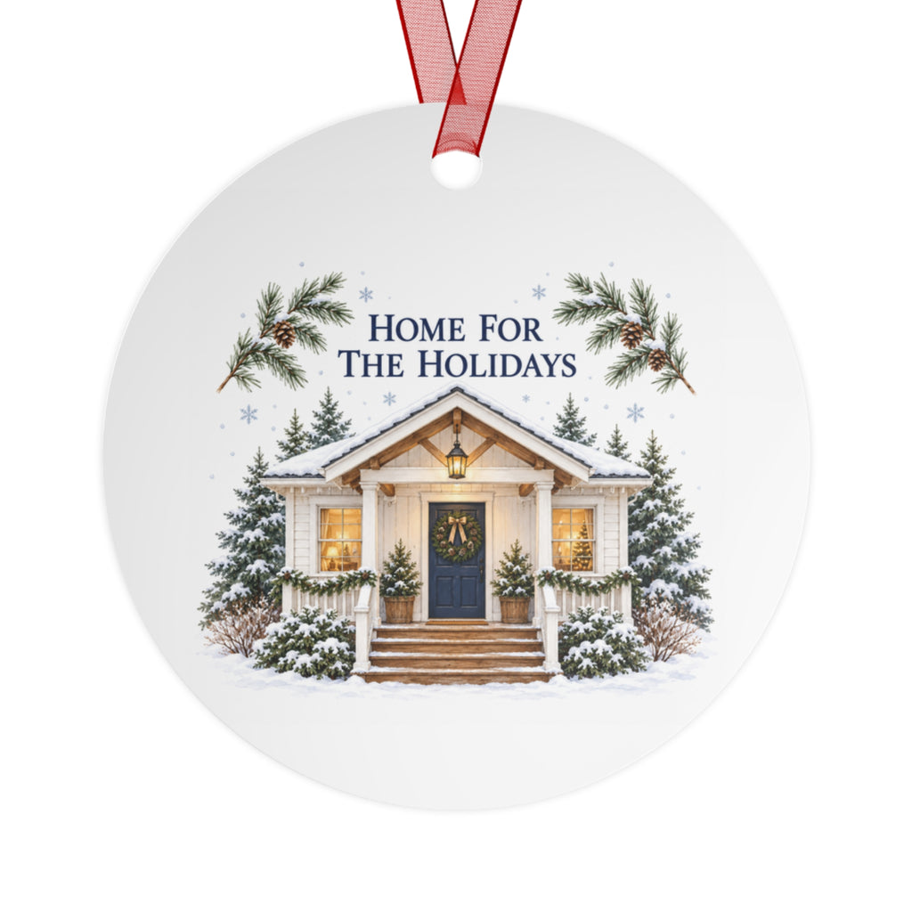 Back view of a round aluminum ornament with winter house artwork.