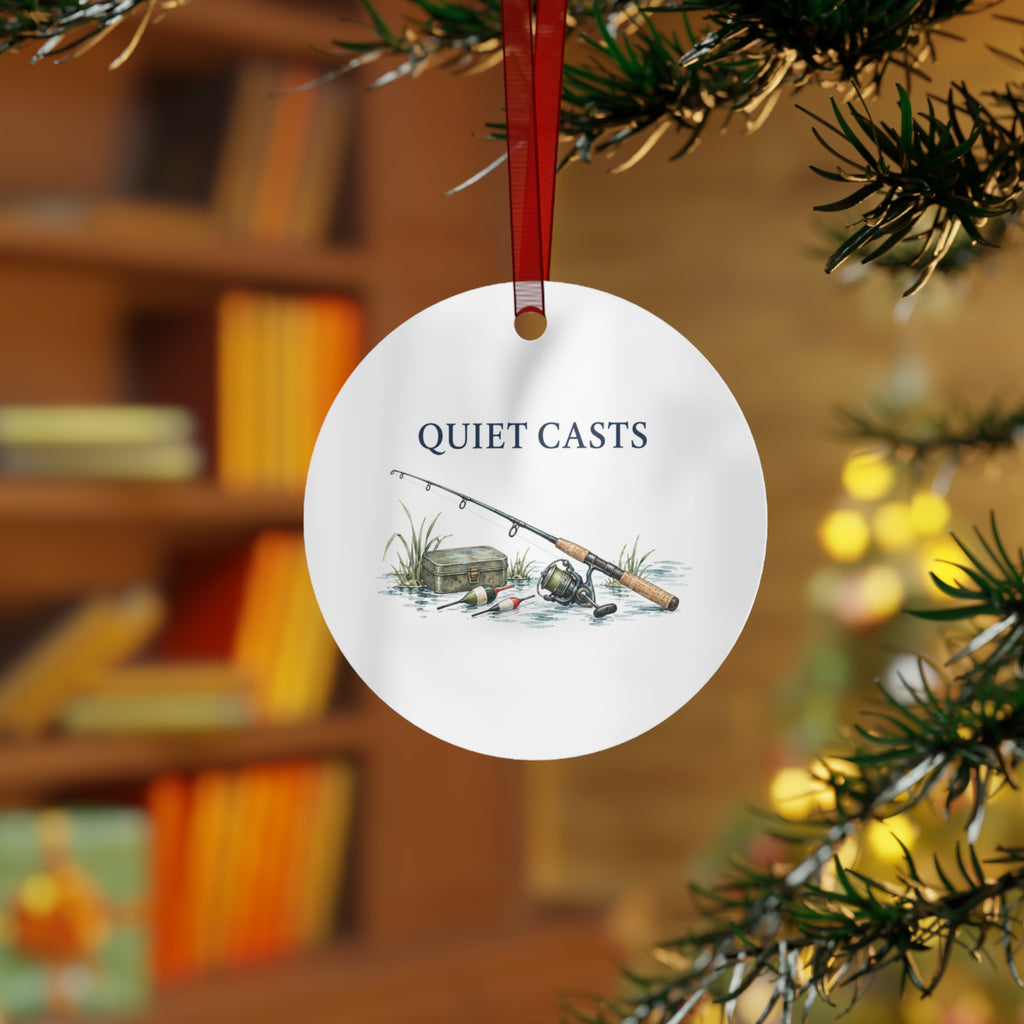 Lifestyle view of the round ornament with fishing artwork and red hanging ribbon.