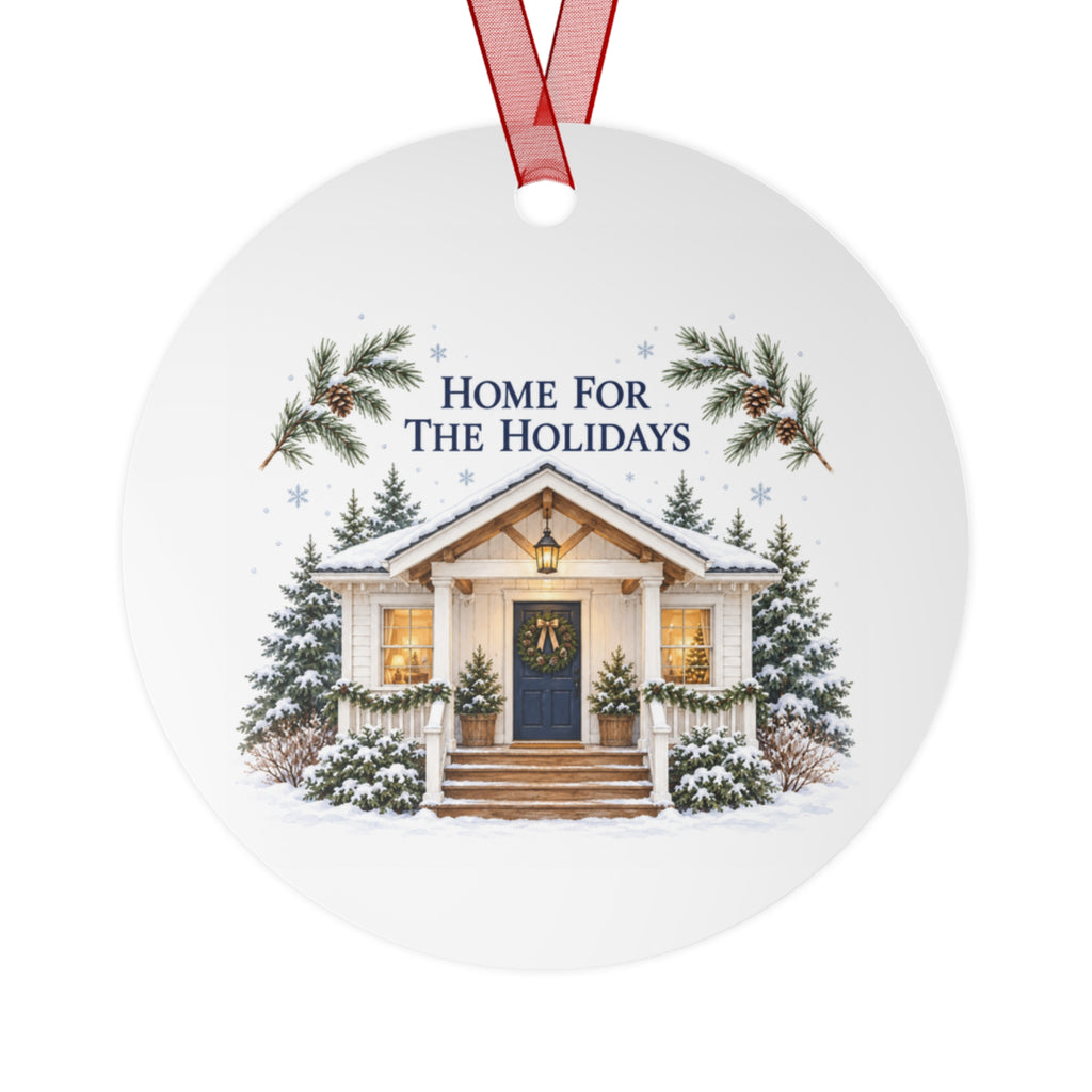 Front view of a round aluminum ornament with winter house artwork.