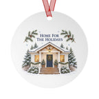 Front view of a round aluminum ornament with winter house artwork.